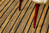 Ribbed jute rug styled in a living room