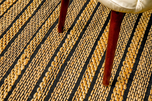 Ribbed jute rug styled in a living room