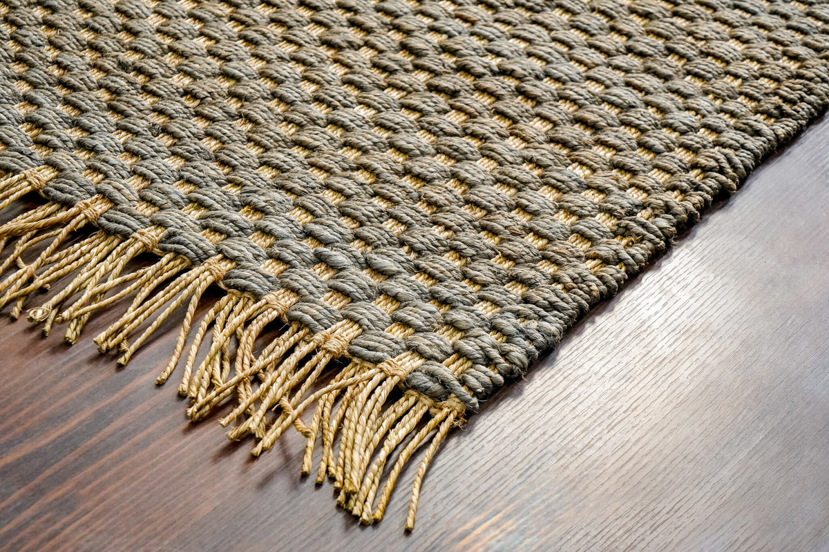 Grey jute rug styled beside furniture