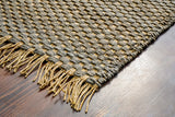 Grey jute rug styled beside furniture