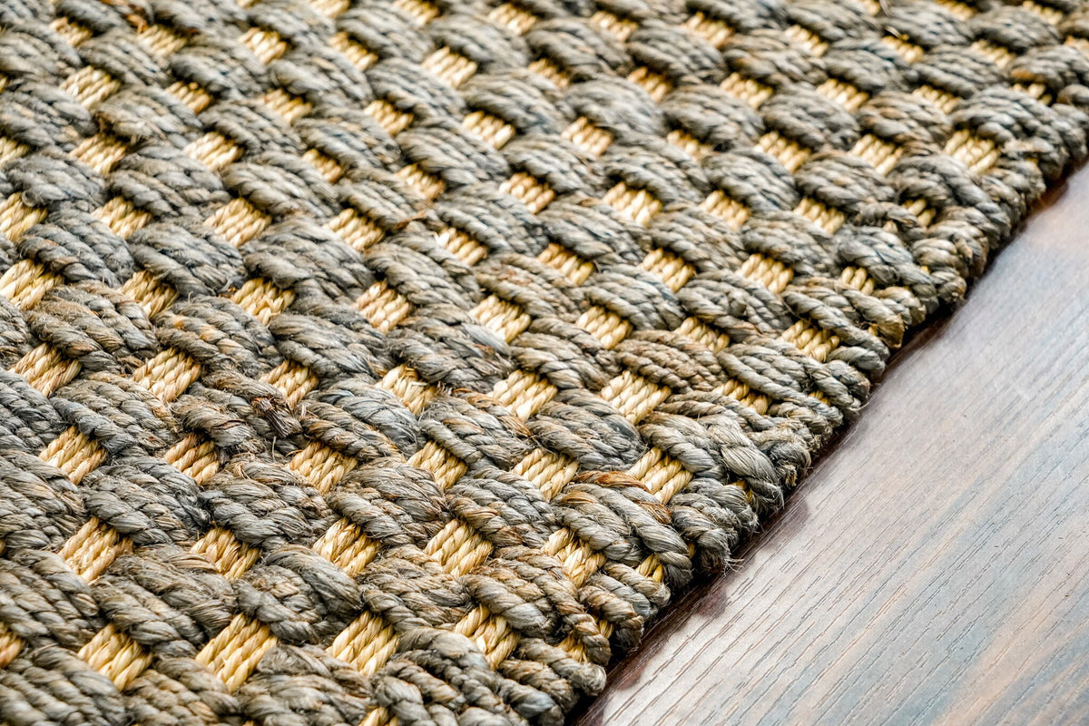 Grey jute rug in a cottage-style bedroom