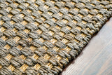 Grey jute rug in a cottage-style bedroom