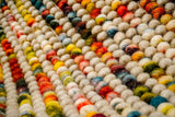 Striped wool rug styled beside furniture