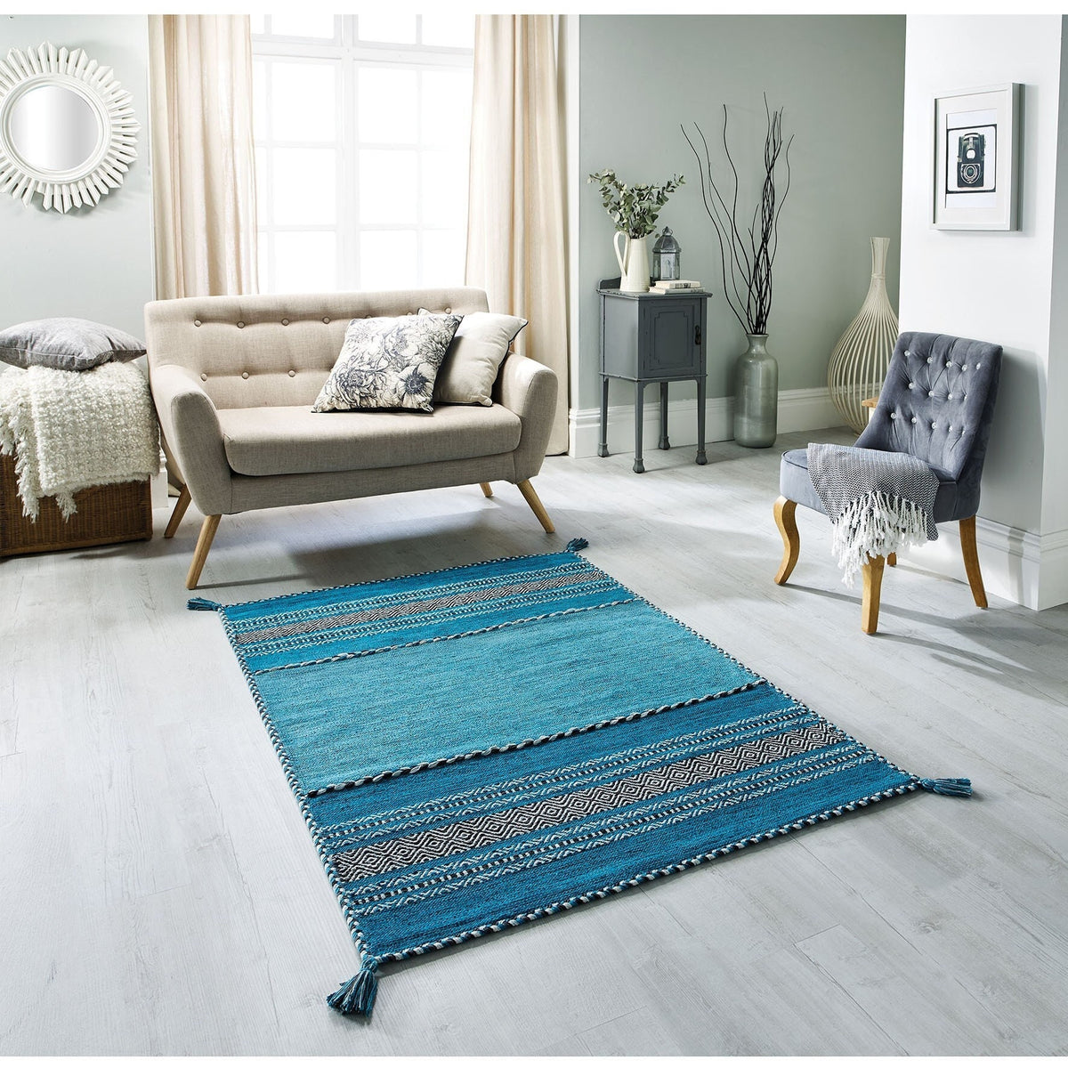 Teal blue kilim rug styled in a living room