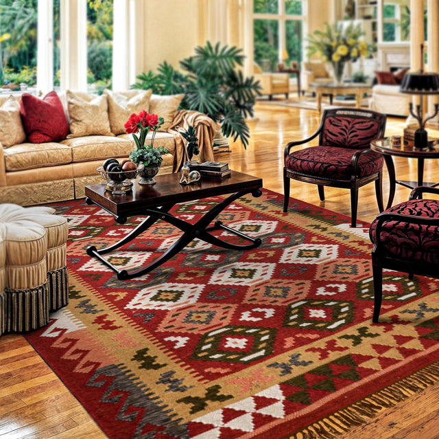 Red traditional kilim rug, flat lay view