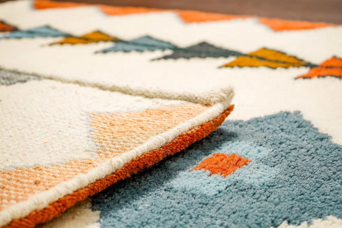 Close-up of hand-knotted texture on multicolor rug