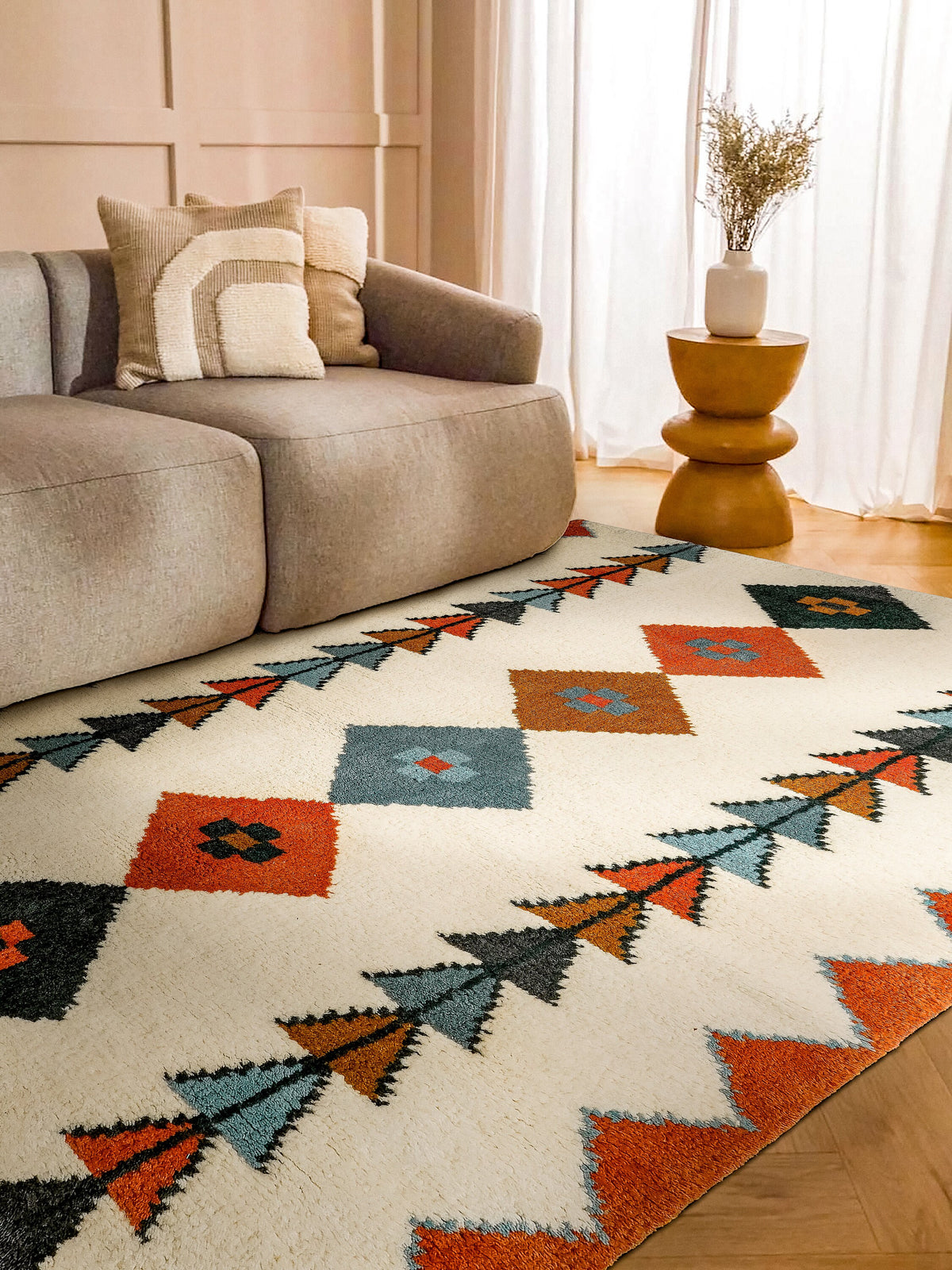 Multicolor rug styled with boho furniture