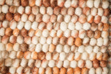 Blended brown chunky looped wool rug, flat lay view