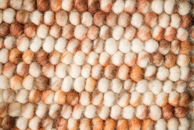 Blended brown chunky looped wool rug, flat lay view
