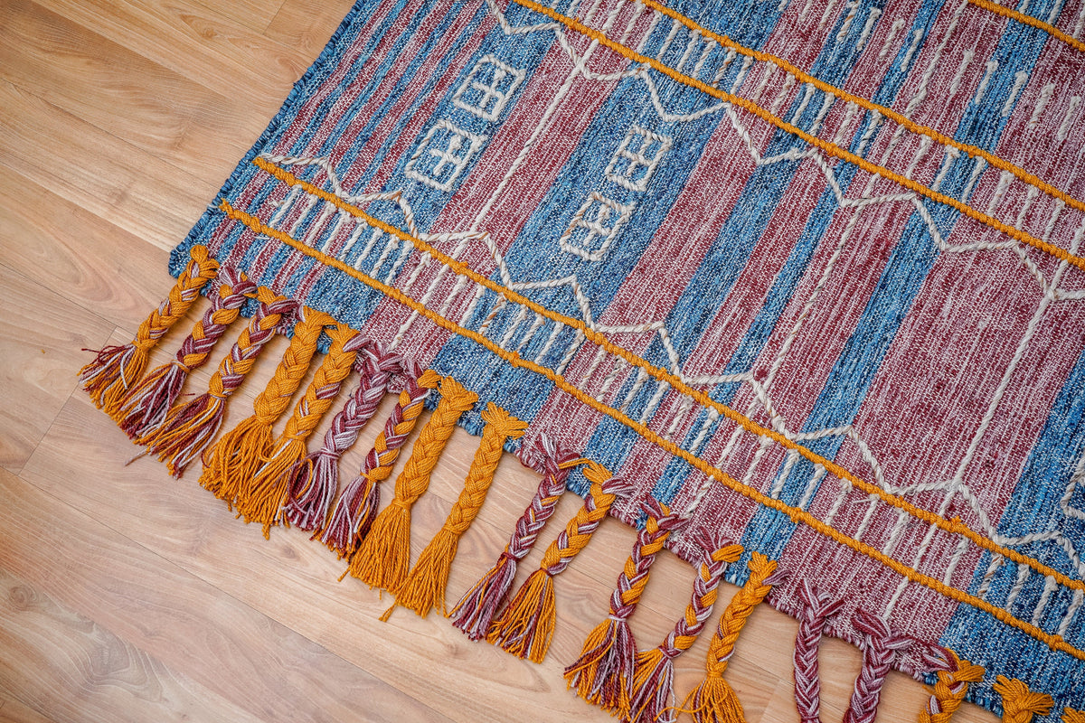 Kilim rug in bedroom setting with natural light
