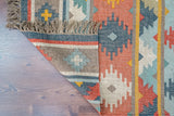 Navajo inspired kilim rug styled in a living room