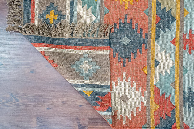Navajo inspired kilim rug styled in a living room
