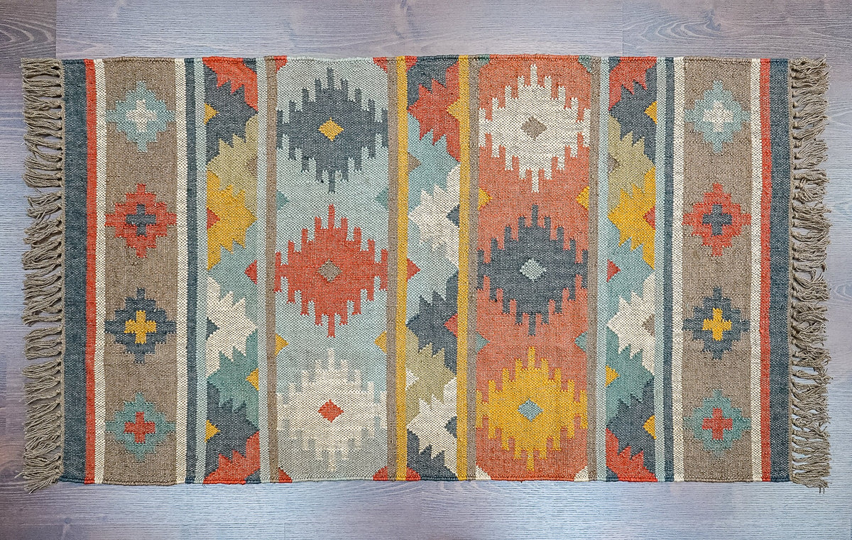 Kilim rug styled with southwest boho decor accents