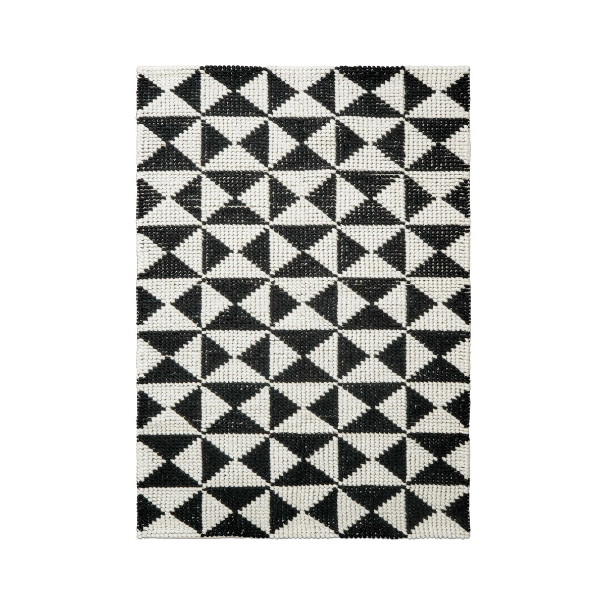 Checkered wool rug styled in a living room
