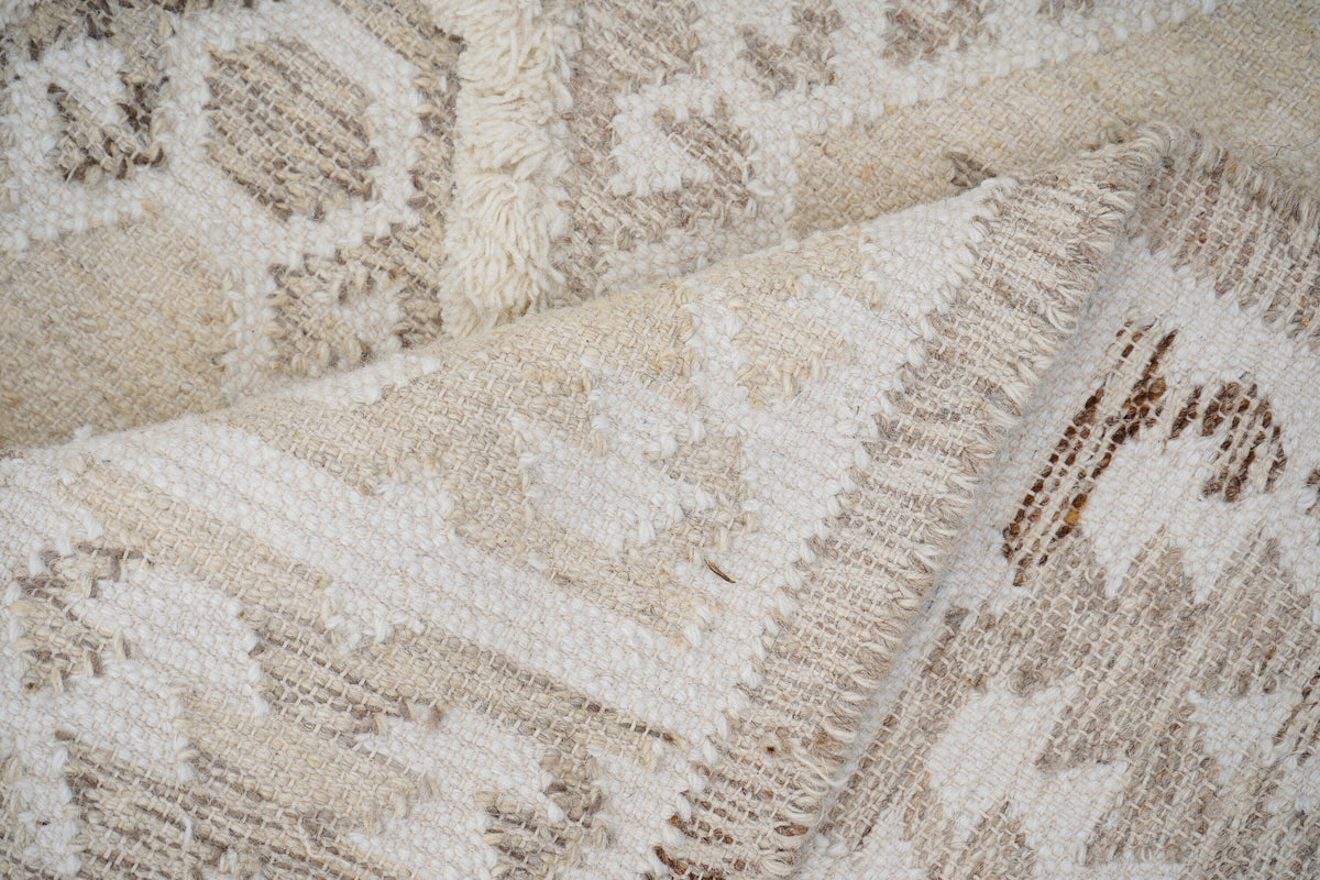 White rug corner detail with fringe edge