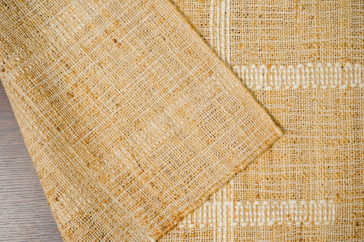 White striped jute rug in a Scandinavian-style living room