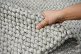 Wool rug corner detail showing high pile texture