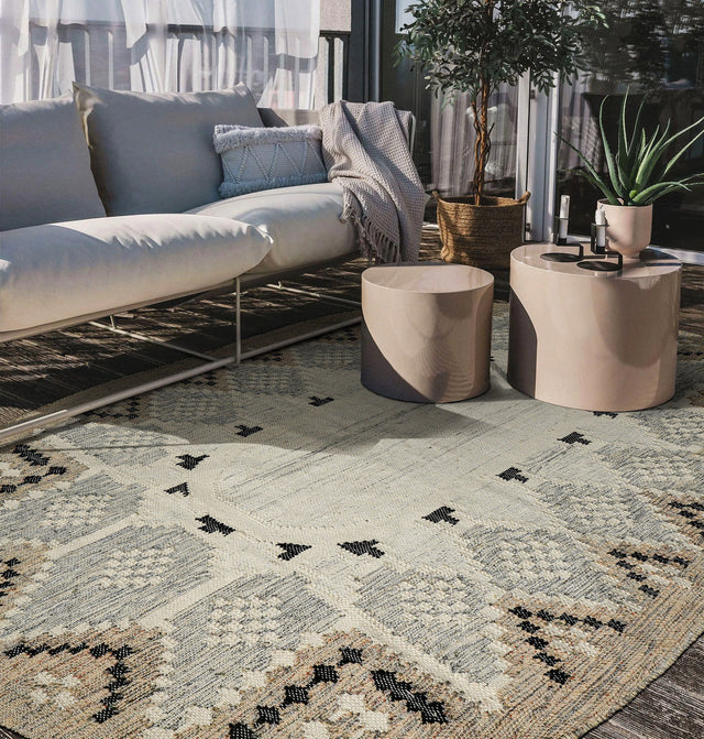 Handwoven beige tribal oval indoor outdoor rug, flat view