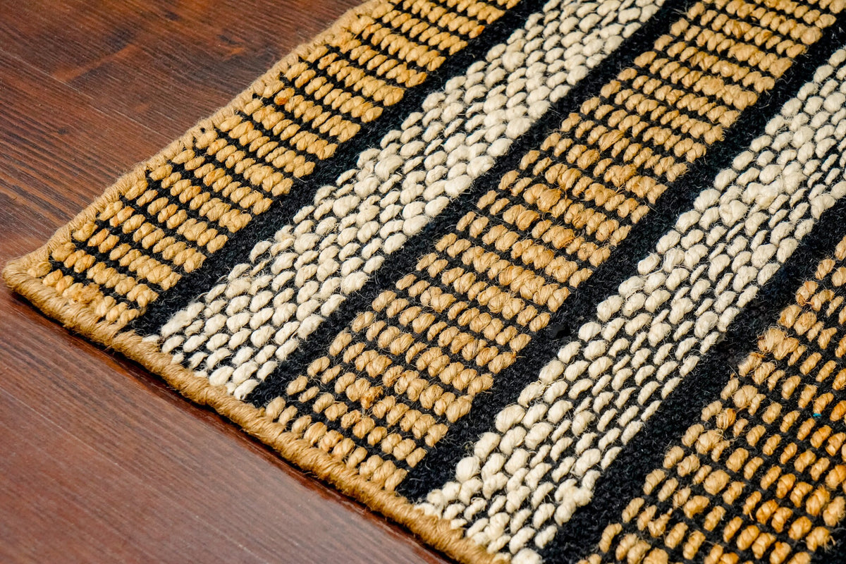 White striped jute rug styled in hallway