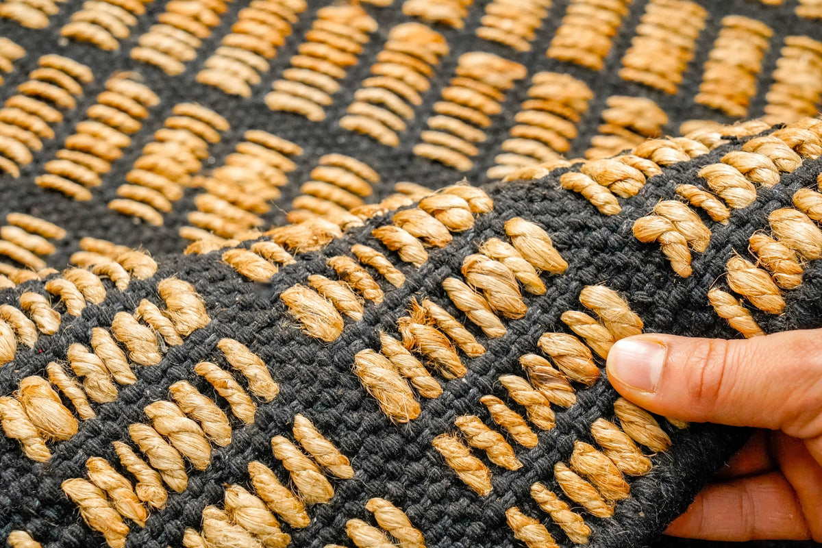 Natural jute rug corner detail showing binding