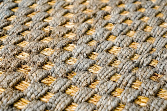 Chunky grey jute area rug, flat lay view