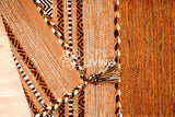 Brown kilim rug edge and border detail