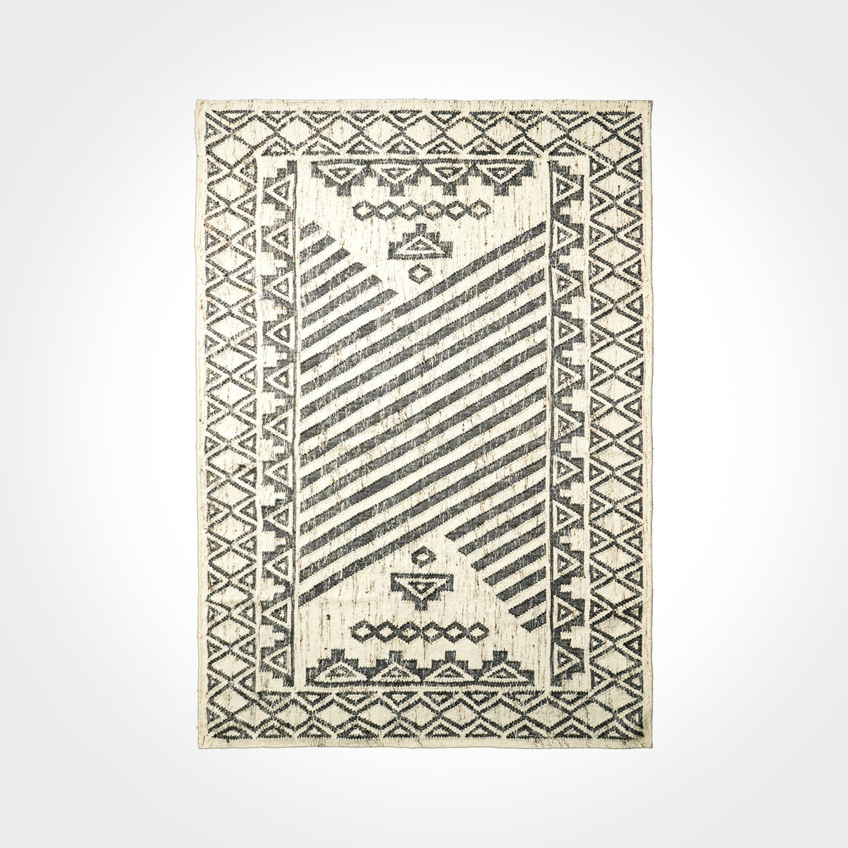 Overhead view of ivory black abstract rug