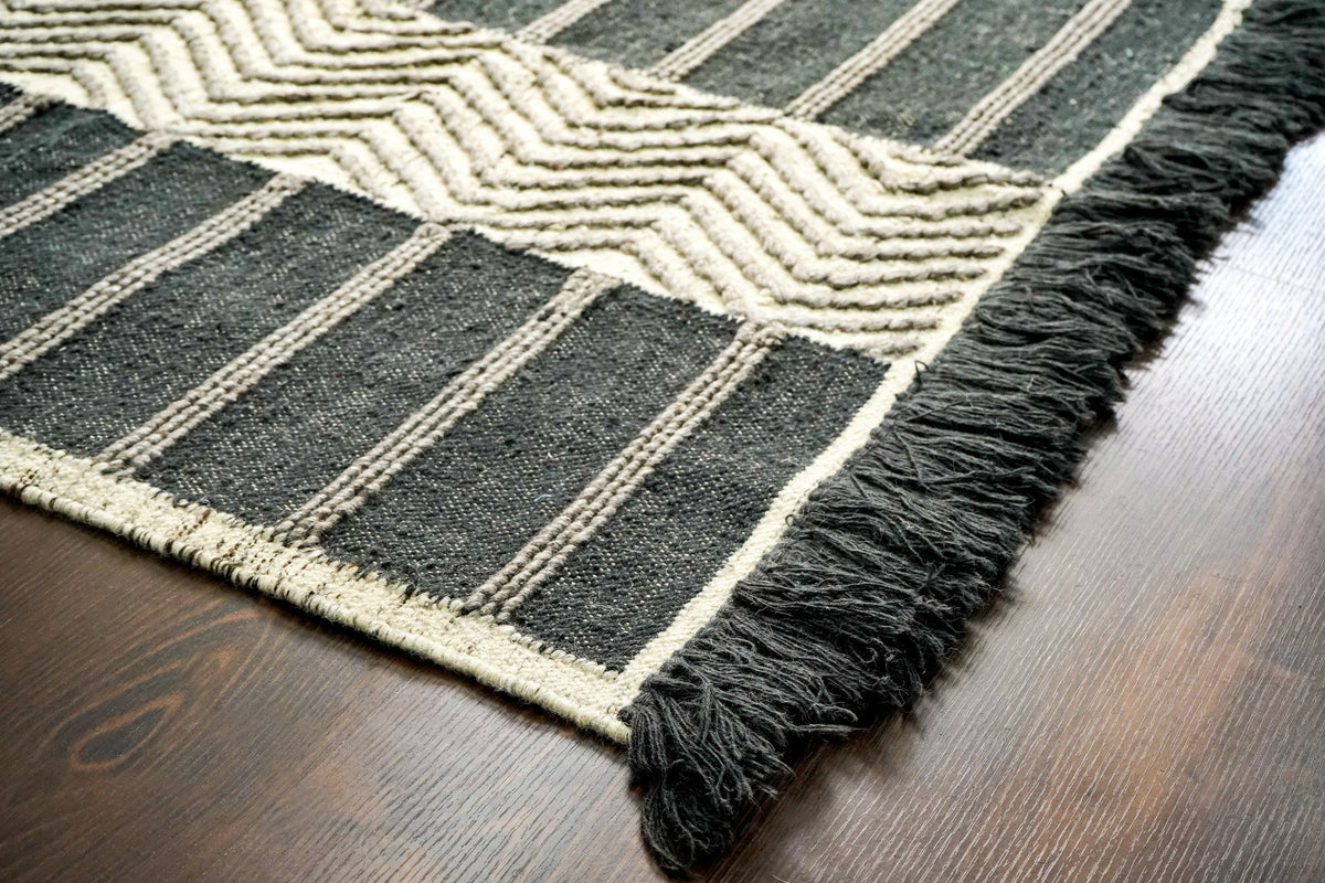 Grey rug styled in hallway