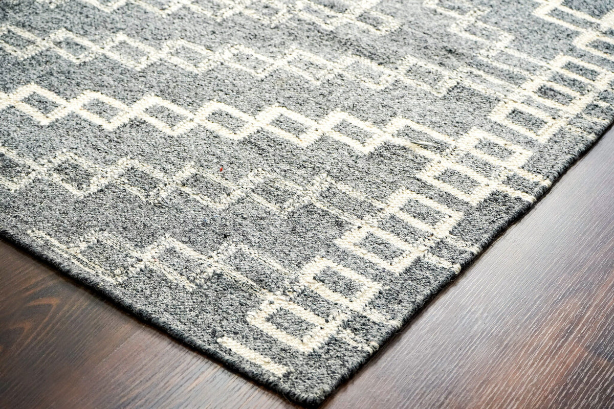 Wide shot of grey abstract rug on floor