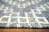 Grey abstract rug in a bedroom setting
