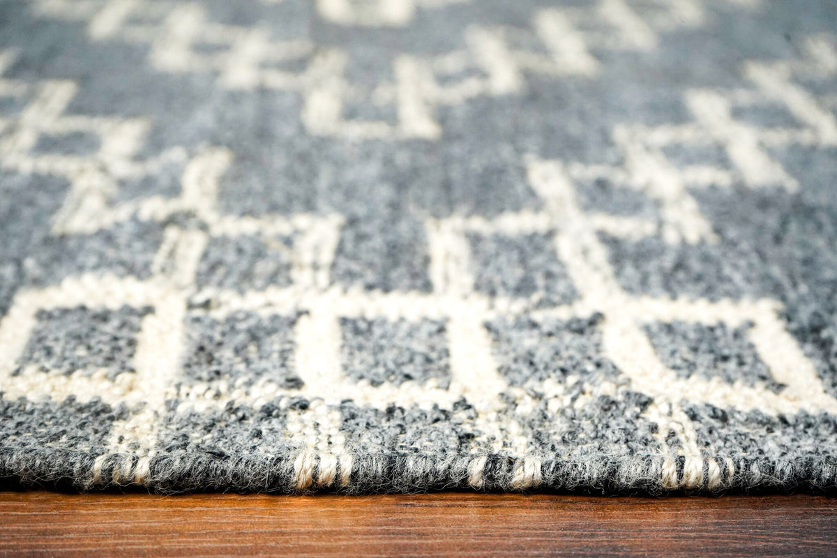 Grey abstract rug in a bedroom setting