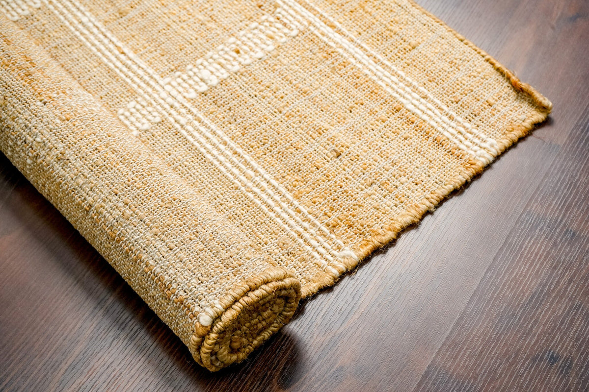 White striped jute rug edge and fringe detail