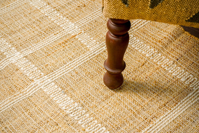 White striped jute rug styled in a living room