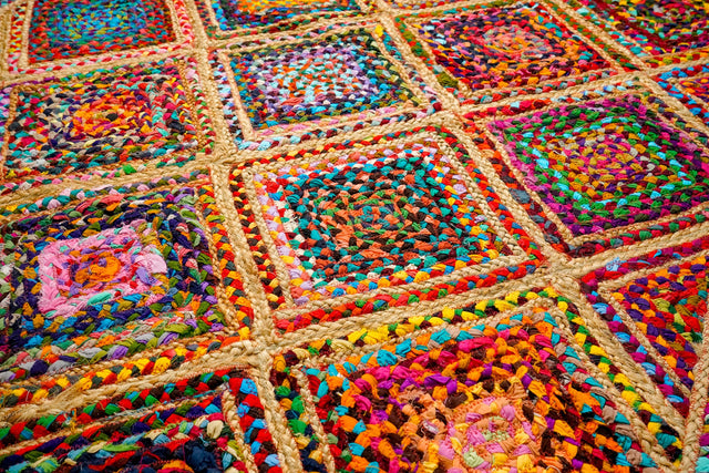 Rainbow diamond rag rug styled in an entryway setting