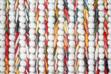 Colourful wool rug corner and edge detail