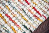 Colourful wool rug under natural light
