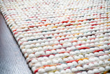 Handwoven colourful wool rug texture close-up