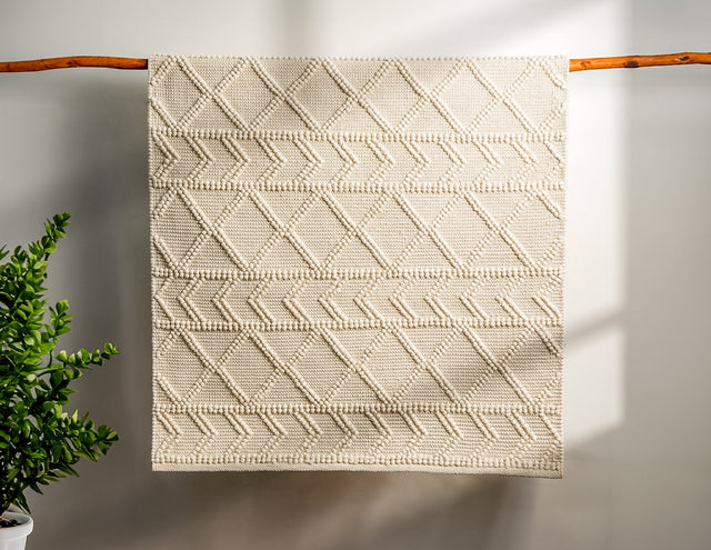 Abstract ivory chunky wool rug styled in living room