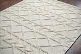 Abstract ivory chunky wool rug weave close-up