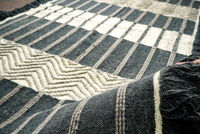 Grey striped rug styled in living room