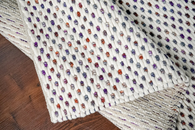 Ivory purple chunky loop wool rug, flat view