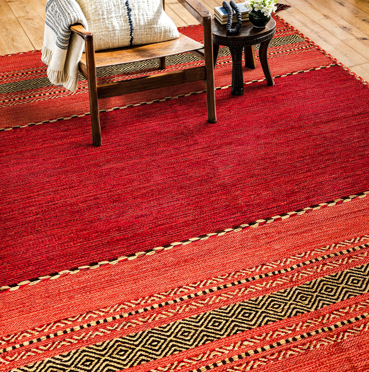 Red kilim rug corner detail showing diamond pattern