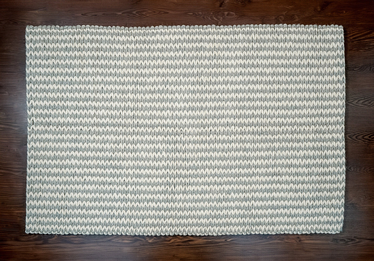 Braided wool rug corner fold showing thickness