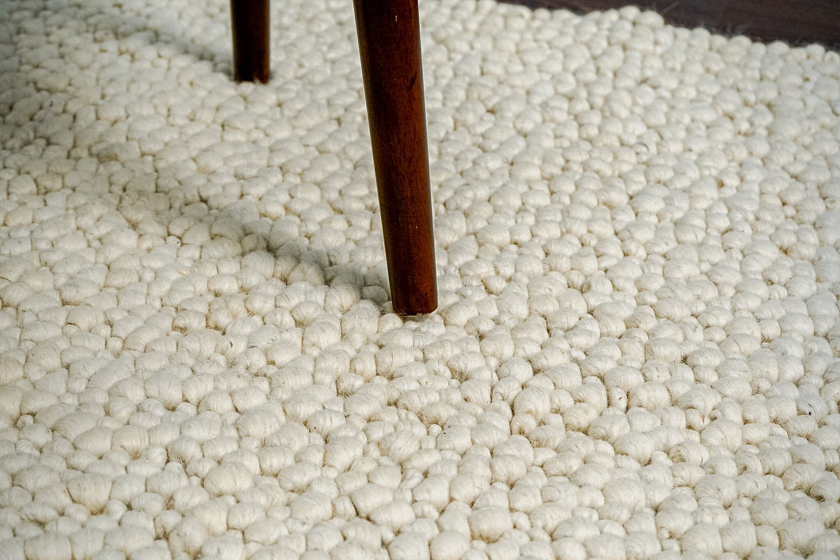 Full view of pebble-texture rug on floor