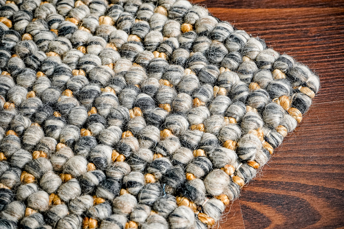 Charcoal grey chunky loop wool jute rug, full flat view