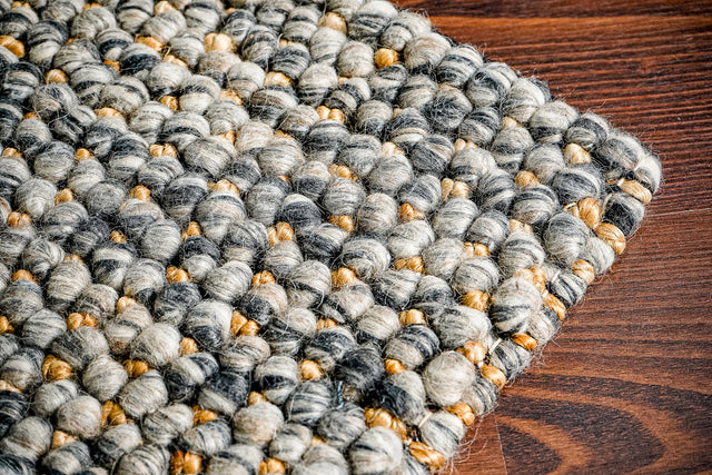 Charcoal grey chunky loop wool jute rug, full flat view