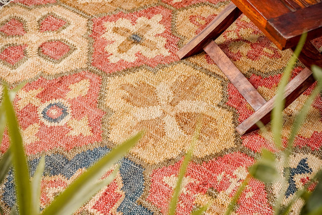 Red floral trellis jute kilim rug, flat lay view
