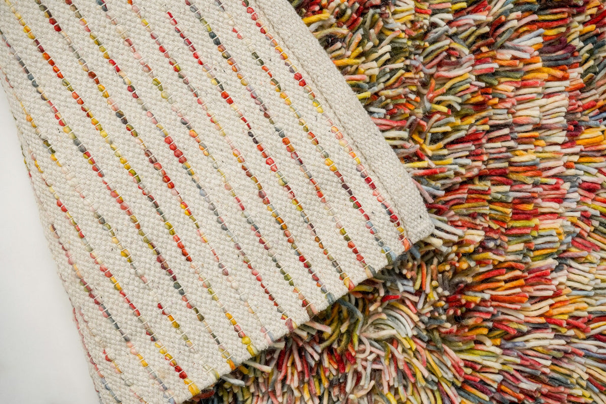 Close-up of felted wool shag pile in rainbow colours