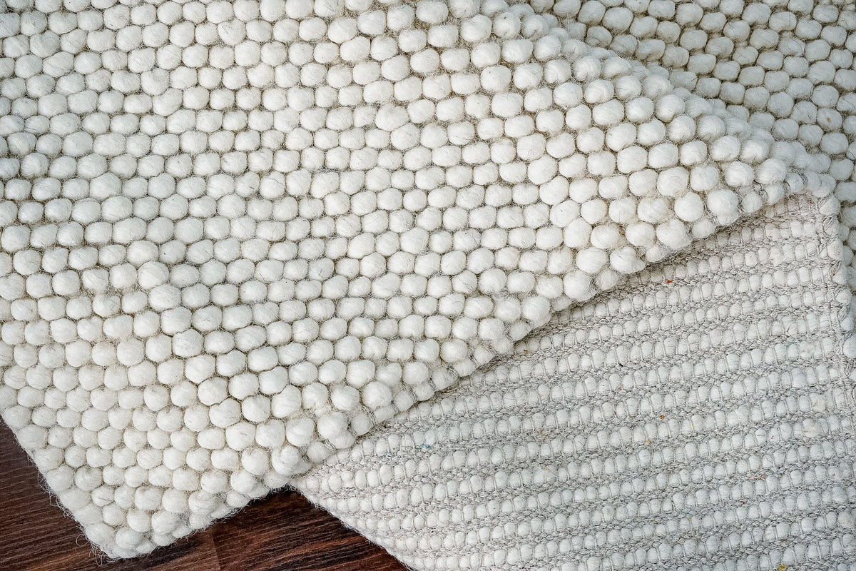 Fluffy ivory rug styled in hallway