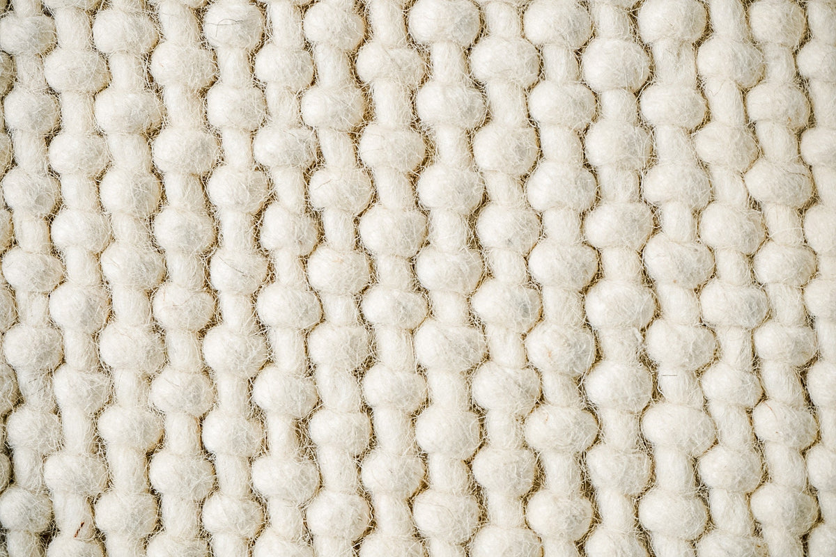 Ivory loop chunky wool rug, flat lay view